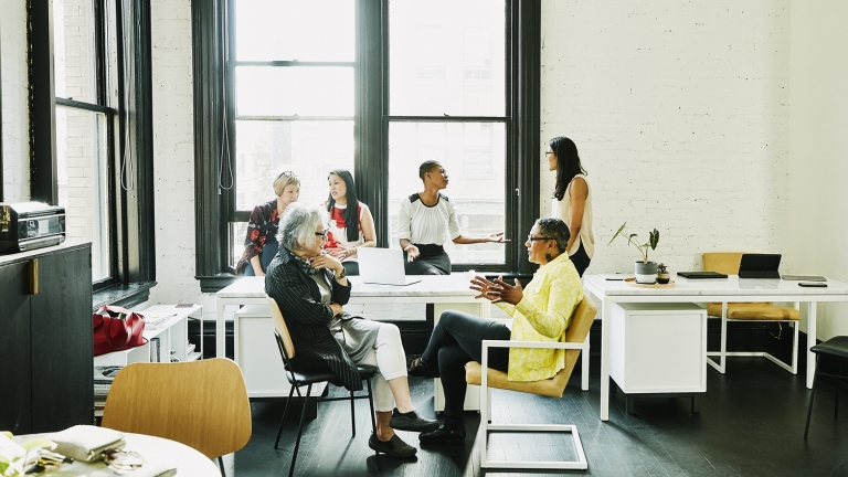 Female coworkers in discussion during team meeting in creative office