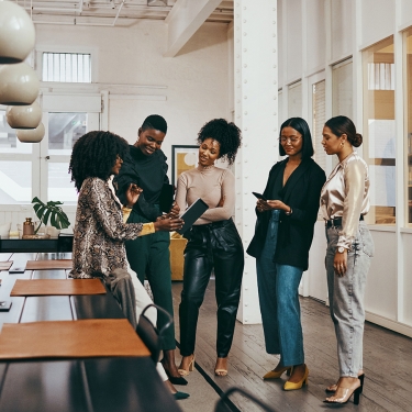 Shot of a group of young businesswomen having a discussion in a modern office.