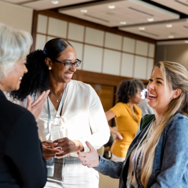 Group of businesswomen having a discussion at a Women.nyc Network event